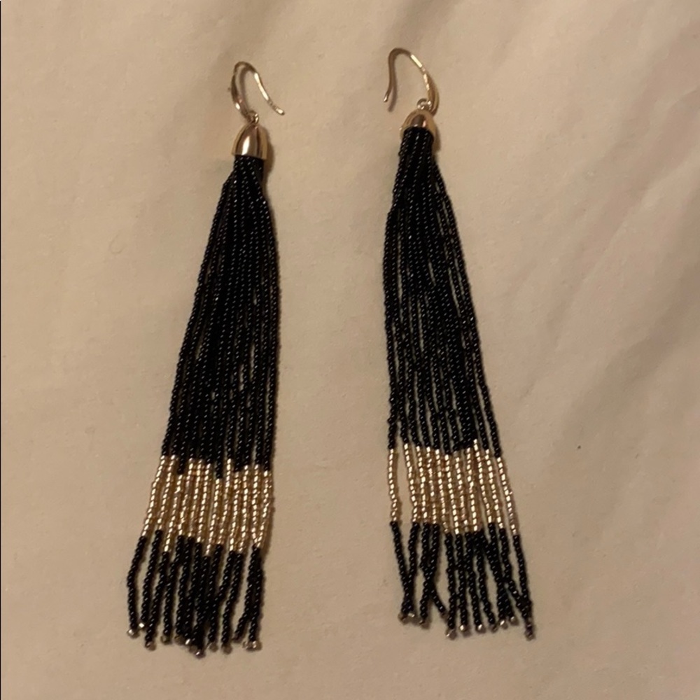Black beaded shoulder duster earring.